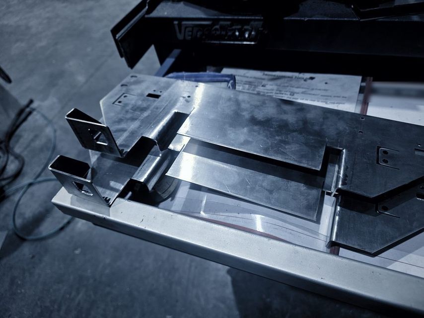 Bright formed stainless parts laid on the fixture table